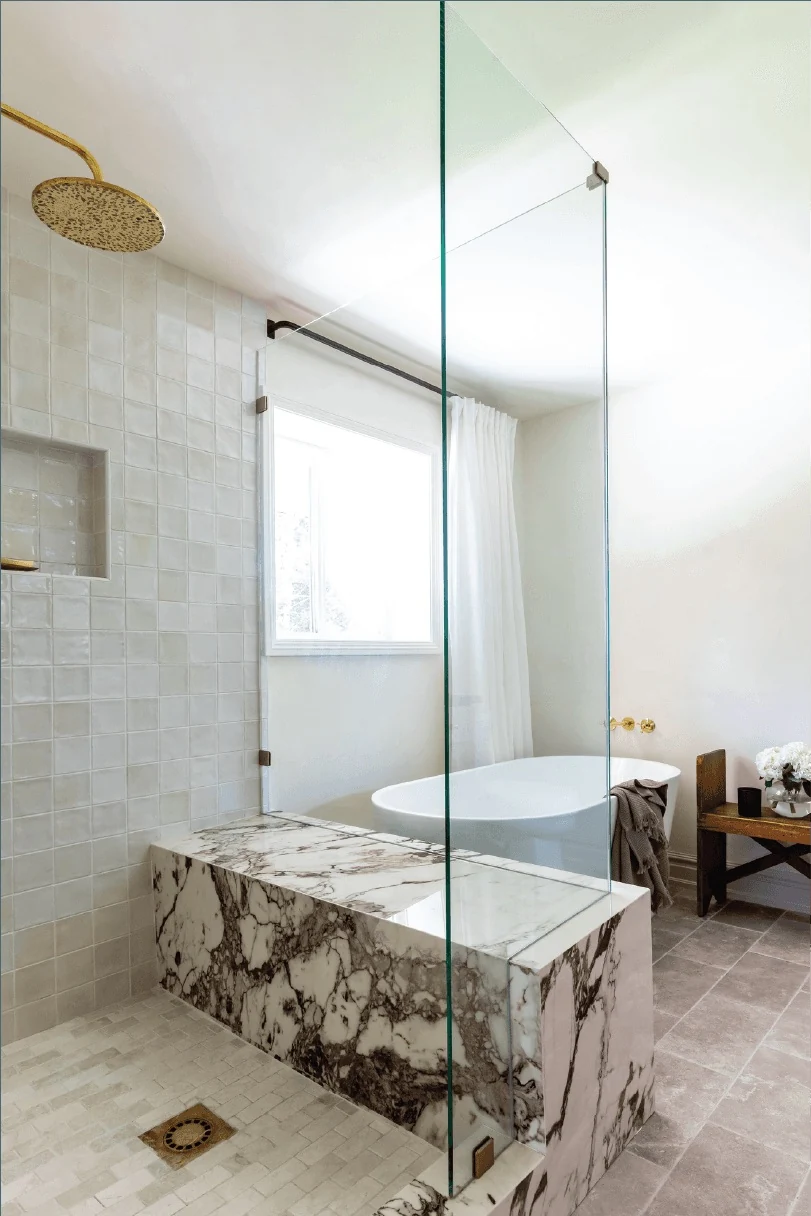 Marble-lined shower and built-in bench