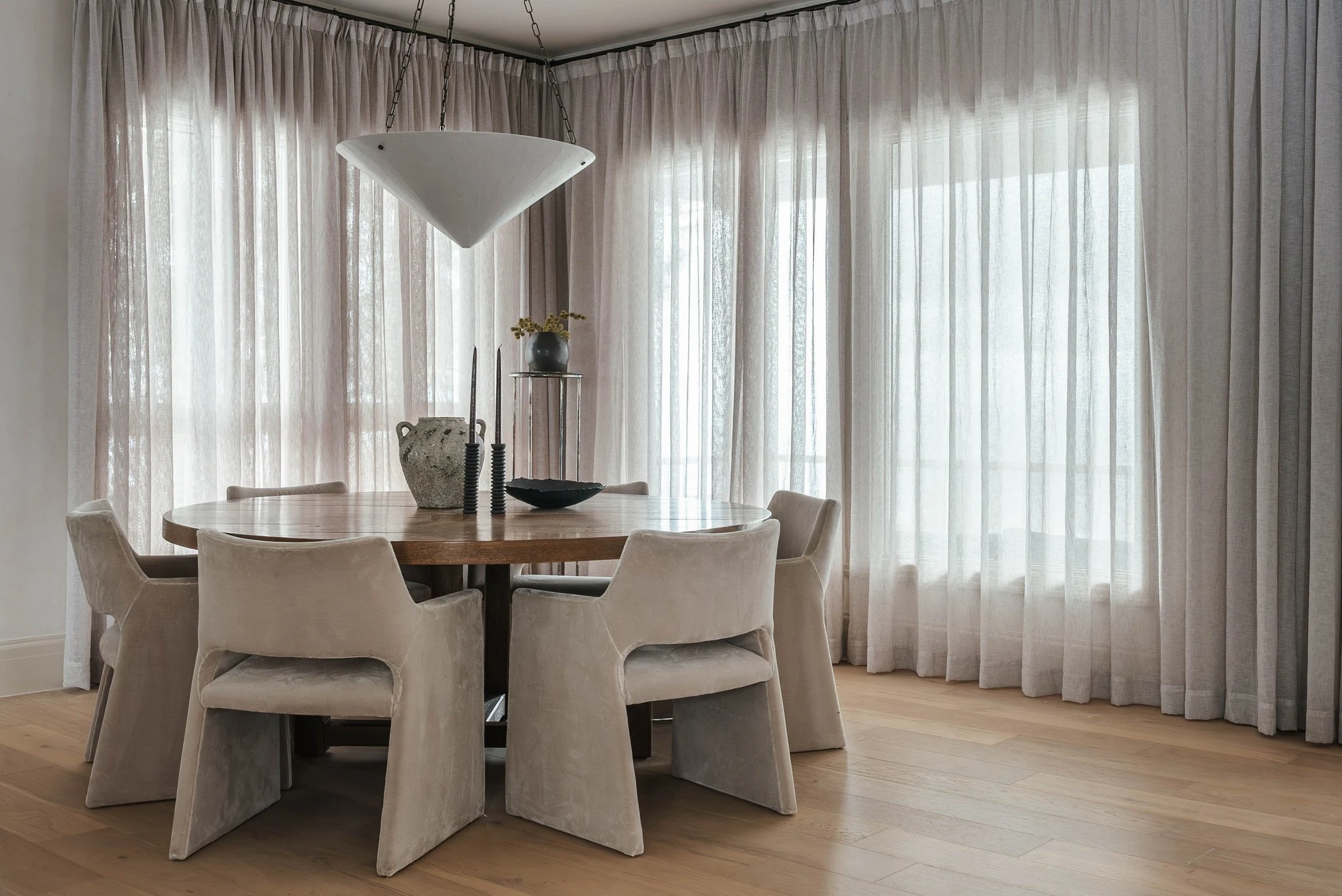 Dining room surrounded by soft drapery