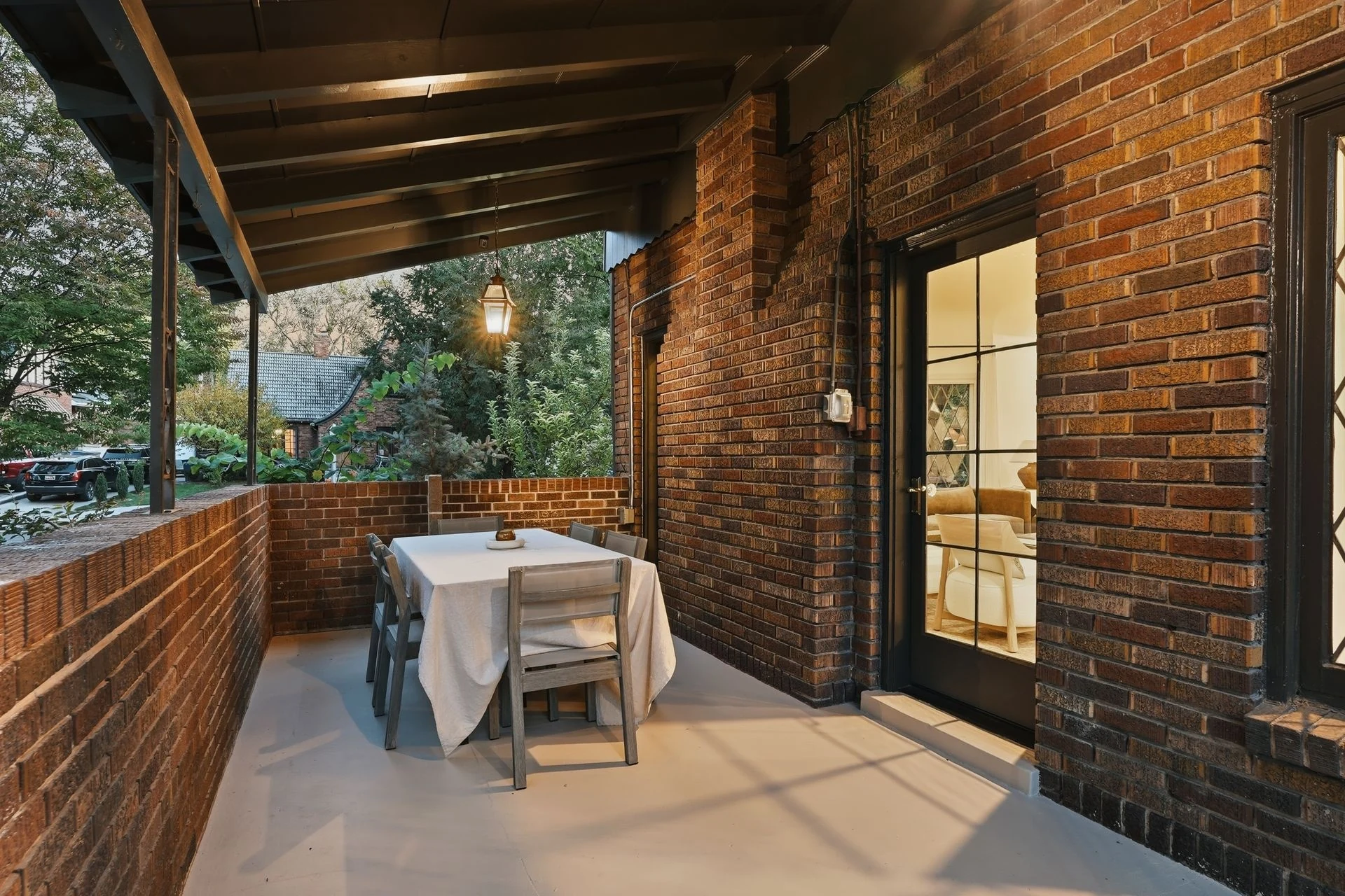 Covered brick porch with timber ceiling